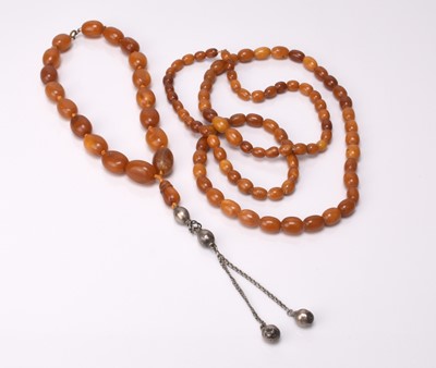 Lot 212 - Two amber bead necklaces