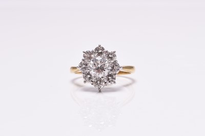 Lot 63 - An 18ct gold diamond floral cluster ring