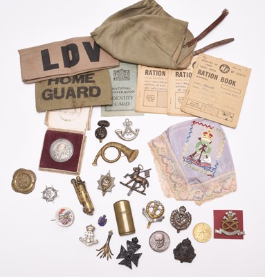 Lot 189 - Militaria including trench lighter, cap badges, sweetheart's handkerchief, etc