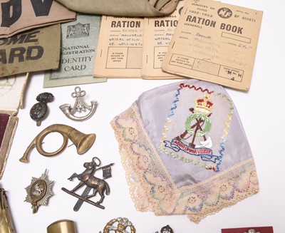 Lot 189 - Militaria including trench lighter, cap badges, sweetheart's handkerchief, etc