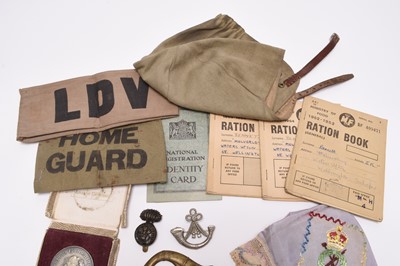 Lot 189 - Militaria including trench lighter, cap badges, sweetheart's handkerchief, etc