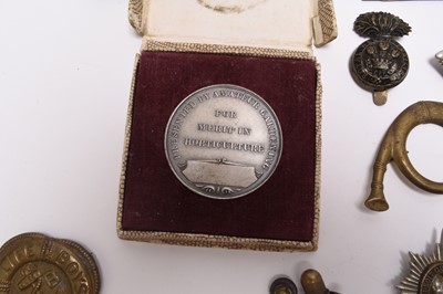 Lot 189 - Militaria including trench lighter, cap badges, sweetheart's handkerchief, etc