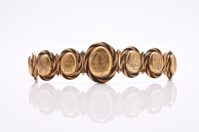 Lot 60 - A 19th century woven hair graduated locket bracelet