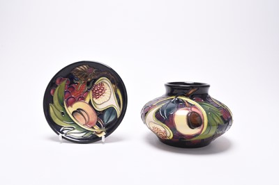 Lot 199 - A Moorcroft vase and matching coaster in the 'Queens' Choice' pattern