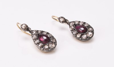 Lot 184 - A pair of cabochon garnet and rose cut diamond ear pendants