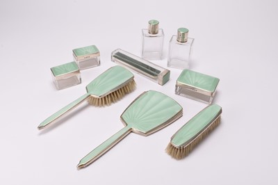 Lot 72 - A nine piece silver and green guilloche enamel dressing table set