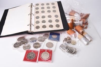 Lot 246 - An album containing a collection of UK shillings from Victoria to Elizabeth II comprising