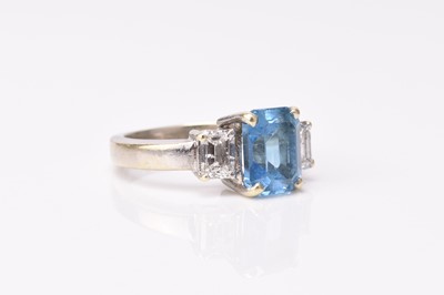 Lot 205 - A 9ct white gold three stone blue topaz and diamond ring