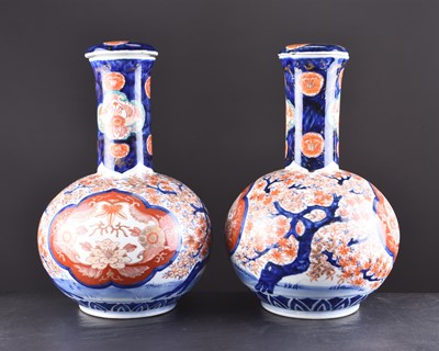 Lot 201 - A pair of Japanese Imari vases and covers, Meiji era