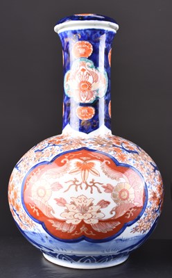 Lot 201 - A pair of Japanese Imari vases and covers, Meiji era