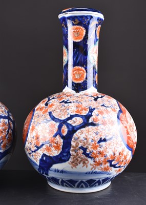 Lot 201 - A pair of Japanese Imari vases and covers, Meiji era