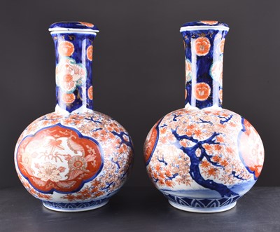 Lot 201 - A pair of Japanese Imari vases and covers, Meiji era