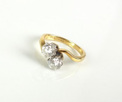 Lot 84 - A two stone diamond crossover ring