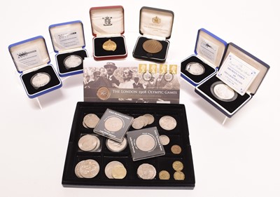 Lot 187 - A small collection of commemorative gold, silver and cupro-nickel comprising two 10k gold Charles Lindberg