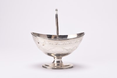 Lot 85 - A George III silver swing handled basket