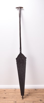 Lot 342 - A Dayak carved wooden paddle and a Dayak carved wooden bowl
