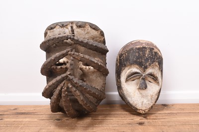 Lot 449 - An African Kwele tribal mask and a Guere Gela mask