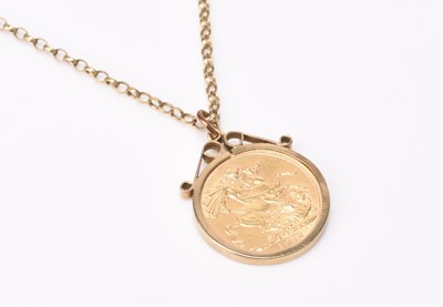 Lot 200 - A George V sovereign within 9ct gold pendant mount