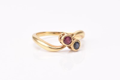 Lot 258 - A French ruby and sapphire crossover ring