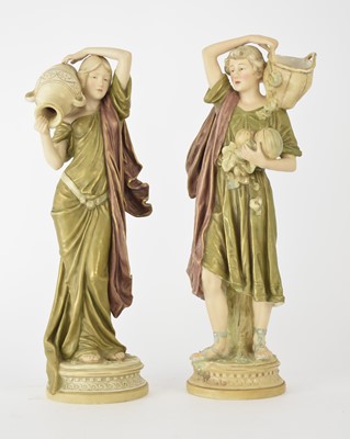 Lot 164 - A pair of Royal Dux figures of a water carrier and fruit gatherer, early 20th century