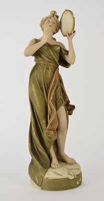 Lot 165 - A large Royal Dux figure of a lady playing the tambourine