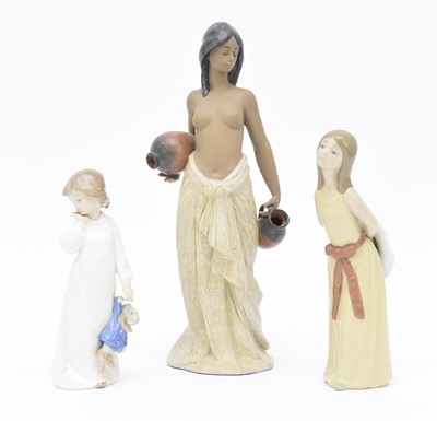 Lot 166 - Lladro semi-nude water carrier model and two others