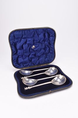 Lot 49 - An Edwardian cased set of four silver seal top spoons