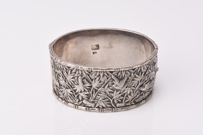 Lot 128 - A Chinese silver bangle by Wang Hing