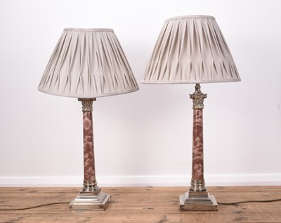 Lot 384 - A pair of electroplate and variegated pink marble Corinthian column table lamps
