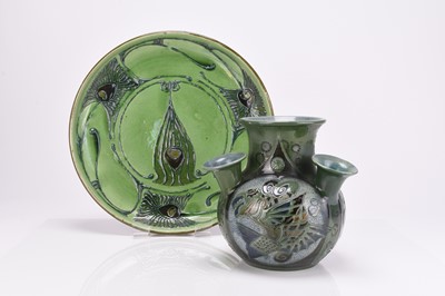 Lot 50 - Art Nouveau CH Brannam 'Peacock' feather charger and a 'Fish' vase