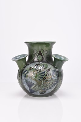 Lot 50 - Art Nouveau CH Brannam 'Peacock' feather charger and a 'Fish' vase