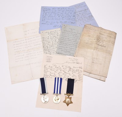 Lot 127 - A Victorian group of three Royal Navy / Coastguard medals, including Egypt 1882, with paperwork