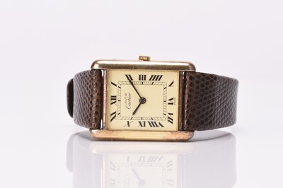 Lot 326 - Cartier: A lady's silver gilt Must de Tank wristwatch