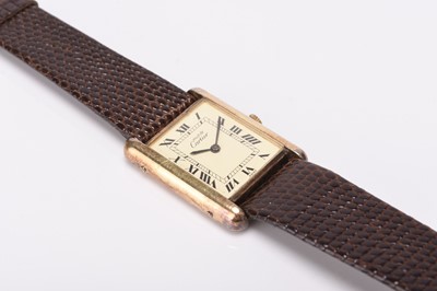 Lot 326 - Cartier: A lady's silver gilt Must de Tank wristwatch