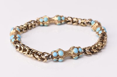 Lot 223 - A yellow metal turquoise set bracelet