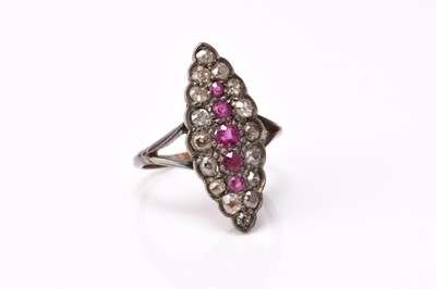 Lot 176 - A diamond and untested ruby cluster ring