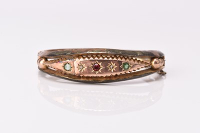 Lot 161 - A diamond and paste set hinged bangle