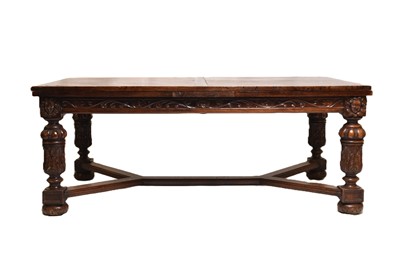 Lot 161 - A French carved oak extending dining table