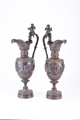 Lot 140 - A pair of ornamental bronze wine ewers, late 19th century