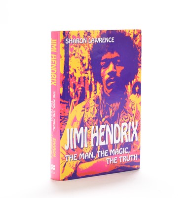 Lot 54 - HENDRIX, Jimi (1942-70) autograph on a piece of paper pasted to the half title of book