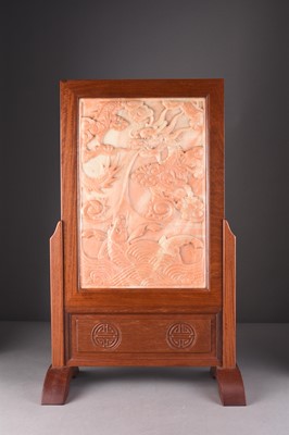 Lot 135 - A Chinese carved soapstone dragon panel in later rosewood table screen