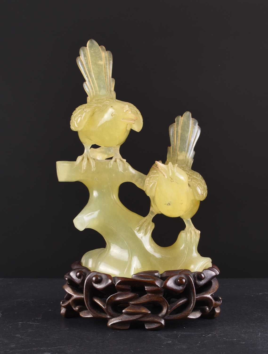 Lot 151 - A Chinese bowenite carving of birds on a tree branch