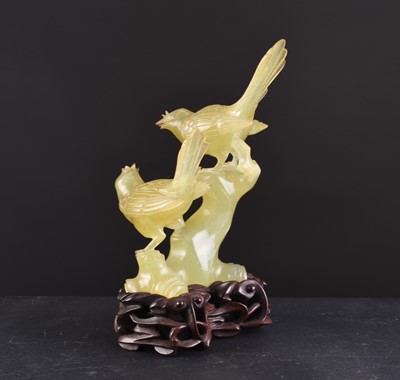 Lot 151 - A Chinese bowenite carving of birds on a tree branch