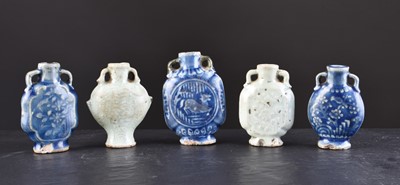 Lot 92 - A collection of five Chinese monochrome glazed porcelain snuff bottles