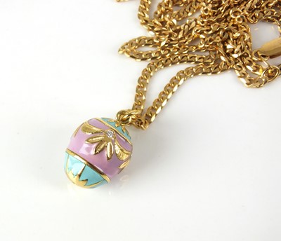 Lot 24 - A diamond and enamel egg pendant on chain