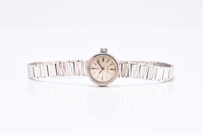 Lot 323 - Omega: A lady's 9ct white gold bracelet watch