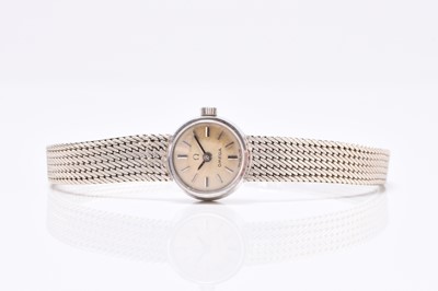 Lot 70 - Omega: A lady's 18ct white gold bracelet watch