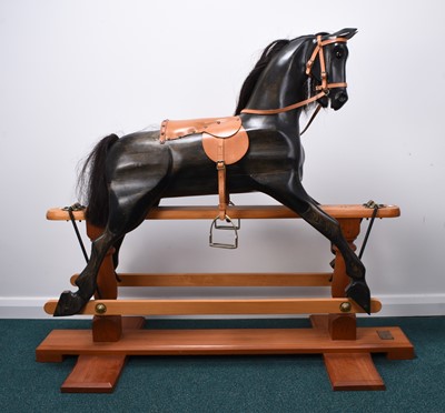 Lot 359 - A large Deborah Fownes carved wood rocking horse