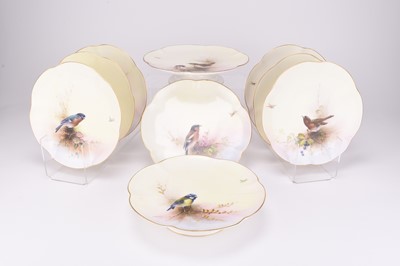 Lot 86 - A Royal Worcester dessert service with birds by E.Barker, dated 1912