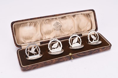 Lot 66 - A cased set of four silver menu/place holders